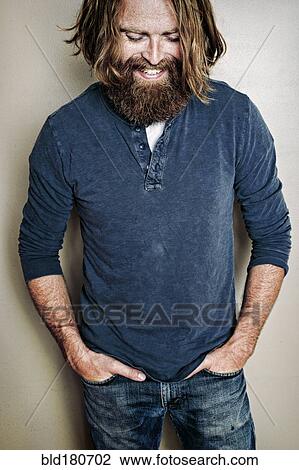 Caucasian man standing with hands in pockets View Large Photo Image Stock Image - Caucasian man standing with hands in pockets. Fotosearch