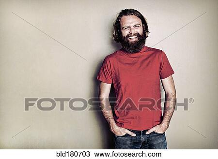 Caucasian man standing with hands in pockets View Large Photo Image Stock Image - Caucasian man standing with hands in pockets. Fotosearch