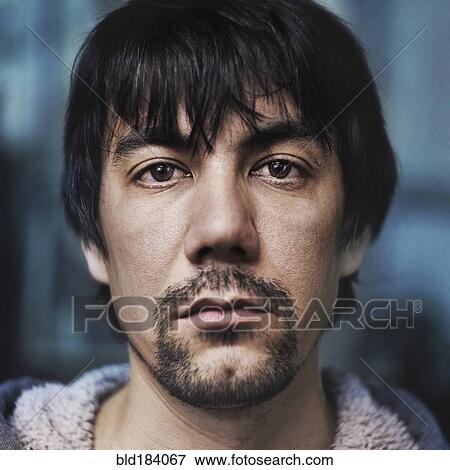 Stock Photo - Caucasian man with beard and messy hair. Fotosearch