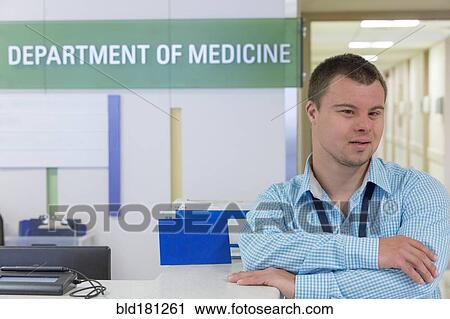 Caucasian man with Down Syndrome working in hospital View Large Photo Image Stock Image - Caucasian man with Down Syndrome working in hospital. Fotosearch