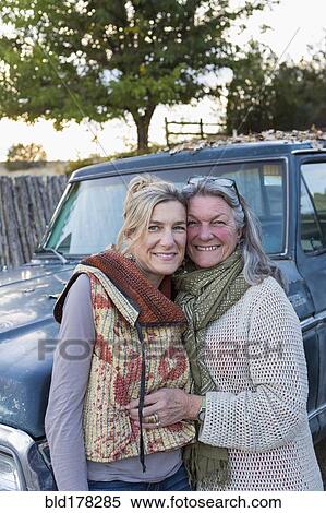 Stock Photography - Caucasian mother and daughter hugging. Fotosearch