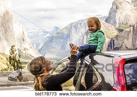 Stock Image - "Caucasian mother and daughter in Yosemite National Park, California, United States". Fotosearch