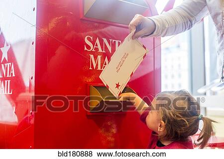 Caucasian mother and daughter mailing letter to Santa View Large Photo Image Stock Photo - Caucasian mother and daughter mailing letter to Santa. Fotosearch