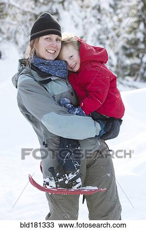 Caucasian mother and son snowshoeing View Large Photo Image Stock Image - Caucasian mother and son snowshoeing. Fotosearch