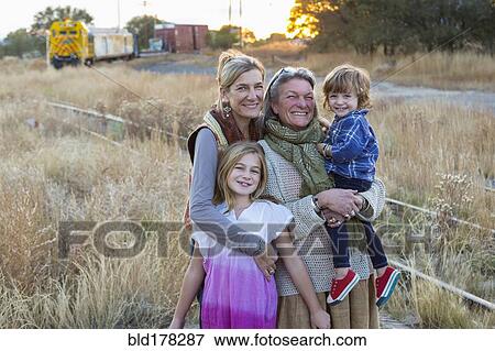 Caucasian mother, grandmother and children smiling outdoors View Large Photo Image Stock Photo - Caucasian mother, grandmother and children smiling outdoors. Fotosearch