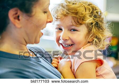 Caucasian mother holding daughter View Large Photo Image Stock Image - Caucasian mother holding daughter. Fotosearch