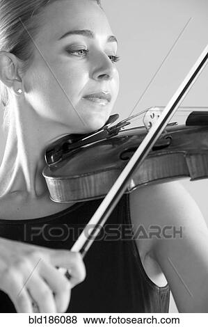 Caucasian musician playing violin View Large Photo Image Stock Photo - Caucasian musician playing violin. Fotosearch