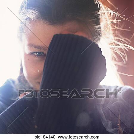 Caucasian teenage girl covering her face View Large Photo Image Stock Image - Caucasian teenage girl covering her face. Fotosearch