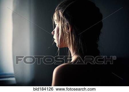 Caucasian teenage girl looking out window View Large Photo Image Stock Photograph - Caucasian teenage girl looking out window. Fotosearch