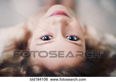 Stock Photograph - Caucasian teenage girl looking up. Fotosearch