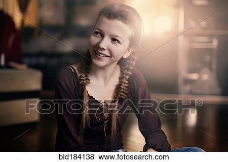 Caucasian teenage girl smiling indoors View Large Photo Image Stock Photo - Caucasian teenage girl smiling indoors. Fotosearch