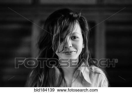 Caucasian teenage girl smiling indoors View Large Photo Image Stock Photo - Caucasian teenage girl smiling indoors. Fotosearch