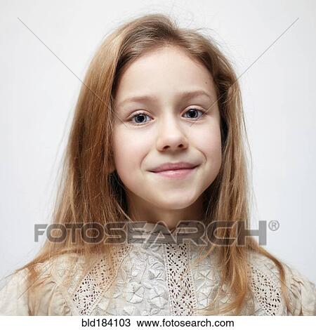 Stock Image - Caucasian teenage girl smiling. Fotosearch