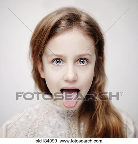 Stock Photo - Caucasian teenage girl sticking out tongue. Fotosearch