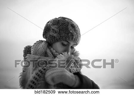 Stock Photo - Caucasian teenage girl wearing scarf outdoors. Fotosearch