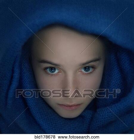 Stock Photo - Caucasian teenage girl wrapped in scarf. Fotosearch