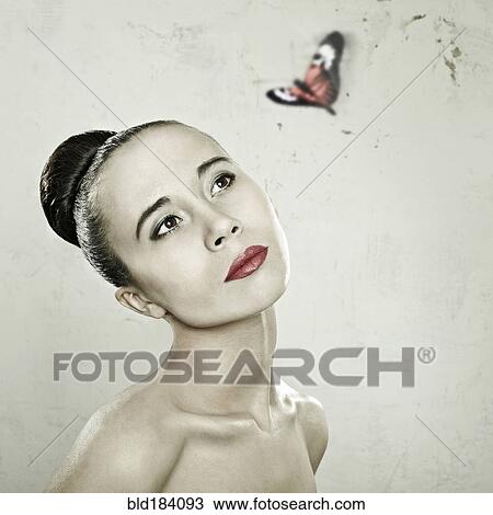 Caucasian woman admiring butterfly View Large Photo Image Stock Image - Caucasian woman admiring butterfly. Fotosearch