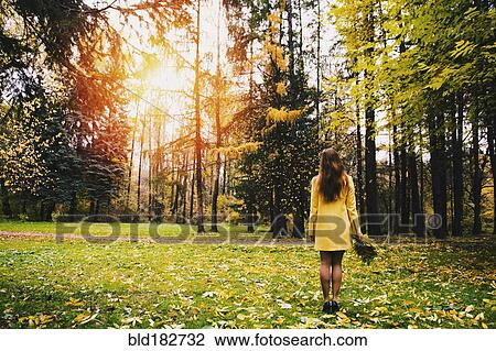 Caucasian woman carrying bouquet in park View Large Photo Image Stock Image - Caucasian woman carrying bouquet in park. Fotosearch
