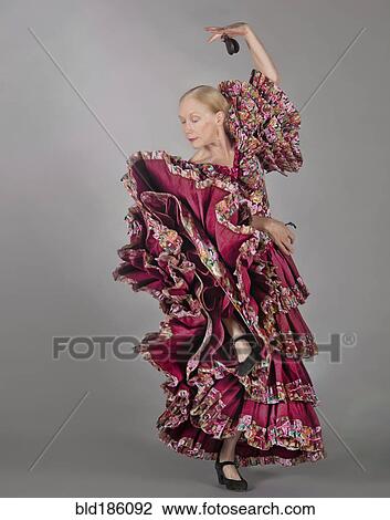 Caucasian woman dancing in ornate dress View Large Photo Image Stock Image - Caucasian woman dancing in ornate dress. Fotosearch