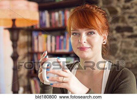 Stock Image - Caucasian woman drinking coffee. Fotosearch