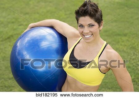 Caucasian woman holding exercise ball outdoors View Large Photo Image Stock Photography - Caucasian woman holding exercise ball outdoors. Fotosearch