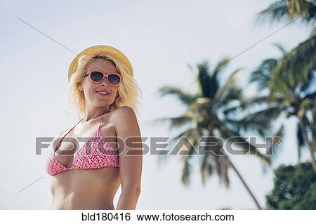 Stock Photograph - Caucasian woman in bikini outdoors. Fotosearch