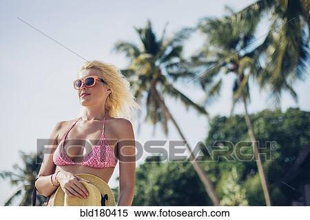 Stock Photography - Caucasian woman in bikini outdoors. Fotosearch