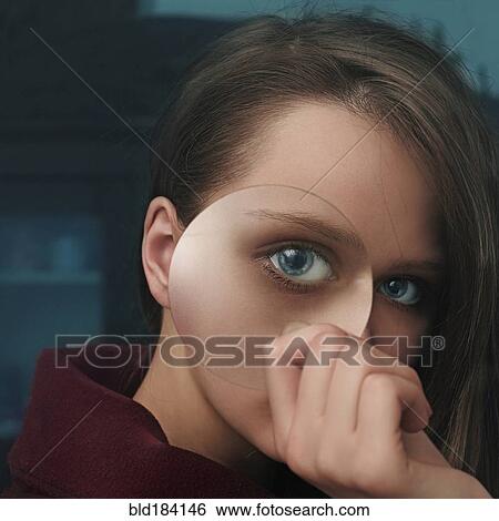 Stock Photograph - Caucasian woman looking through magnifying glass. Fotosearch