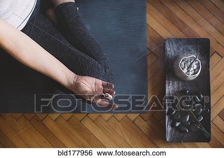 Caucasian woman meditating in yoga studio View Large Photo Image Stock Photograph - Caucasian woman meditating in yoga studio. Fotosearch