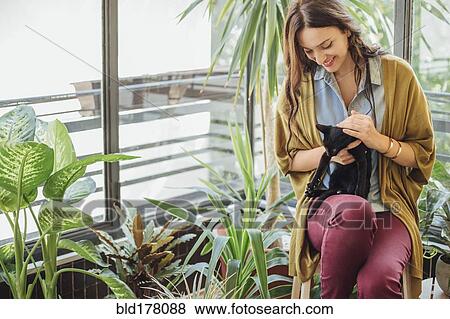 Caucasian woman petting kitten View Large Photo Image Stock Photo - Caucasian woman petting kitten. Fotosearch