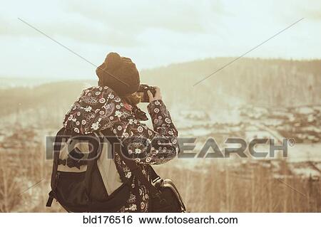 Caucasian woman photographing landscape View Large Photo Image Stock Photograph - Caucasian woman photographing landscape. Fotosearch