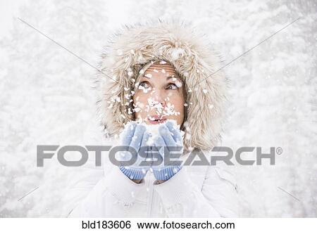 Caucasian woman playing in snow View Large Photo Image Stock Photograph - Caucasian woman playing in snow. Fotosearch