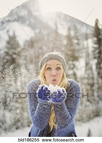 Caucasian woman playing in snow View Large Photo Image Stock Photography - Caucasian woman playing in snow. Fotosearch
