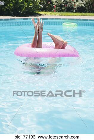Caucasian woman playing in swimming pool View Large Photo Image Stock Image - Caucasian woman playing in swimming pool. Fotosearch
