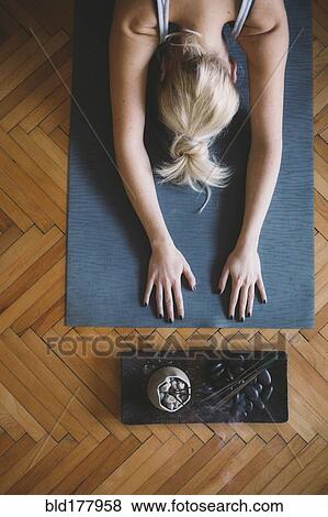 Caucasian woman practicing yoga in studio View Large Photo Image Stock Photo - Caucasian woman practicing yoga in studio. Fotosearch