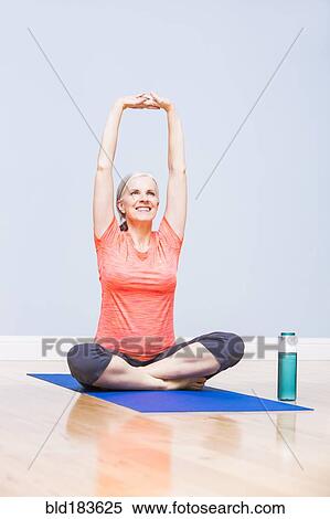 Caucasian woman practicing yoga View Large Photo Image Stock Photography - Caucasian woman practicing yoga. Fotosearch