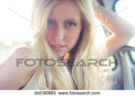 Caucasian woman sitting in car View Large Photo Image Stock Photography - Caucasian woman sitting in car. Fotosearch