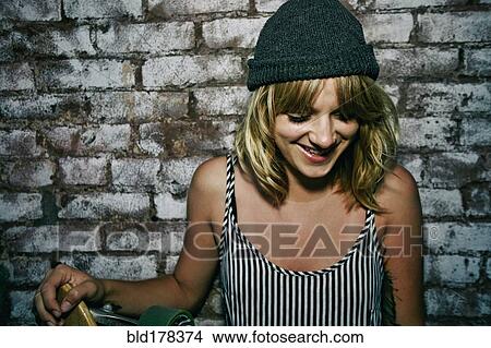 Picture - Caucasian woman smiling outdoors. Fotosearch