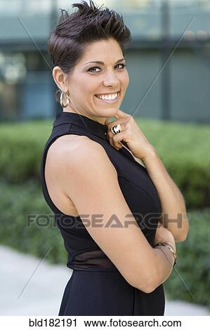 Caucasian woman smiling outdoors View Large Photo Image Stock Image - Caucasian woman smiling outdoors. Fotosearch