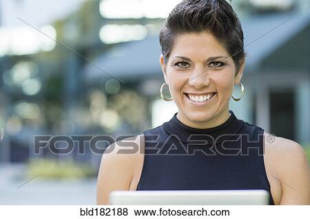 Caucasian woman smiling outdoors View Large Photo Image Stock Photo - Caucasian woman smiling outdoors. Fotosearch