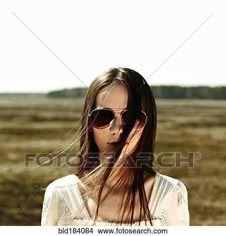 Caucasian woman standing in rural field View Large Photo Image Picture - Caucasian woman standing in rural field. Fotosearch