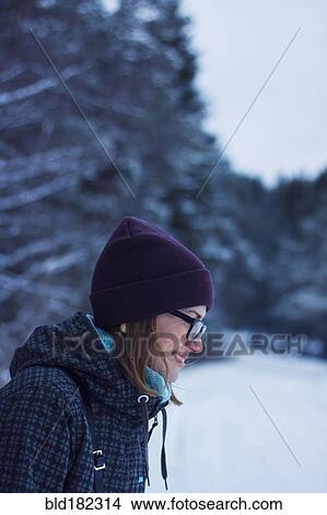 Picture - Caucasian woman standing in snow. Fotosearch