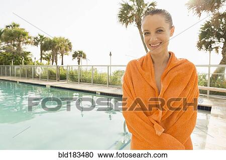 Caucasian woman standing near swimming pool View Large Photo Image Stock Image - Caucasian woman standing near swimming pool. Fotosearch