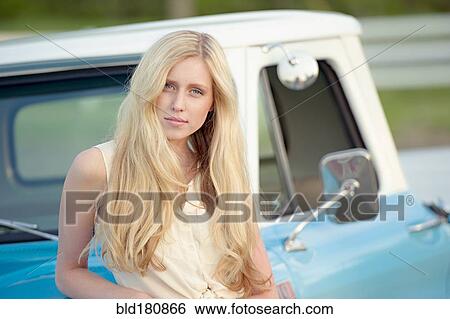 Caucasian woman standing near truck View Large Photo Image Stock Photograph - Caucasian woman standing near truck. Fotosearch