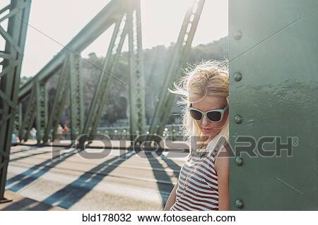 Caucasian woman standing on bridge View Large Photo Image Stock Image - Caucasian woman standing on bridge. Fotosearch