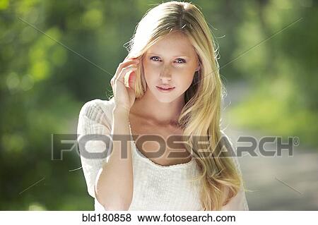 Caucasian woman standing outdoors View Large Photo Image Stock Photo - Caucasian woman standing outdoors. Fotosearch