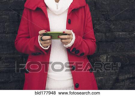 Caucasian woman using cell phone outdoors View Large Photo Image Stock Photo - Caucasian woman using cell phone outdoors. Fotosearch