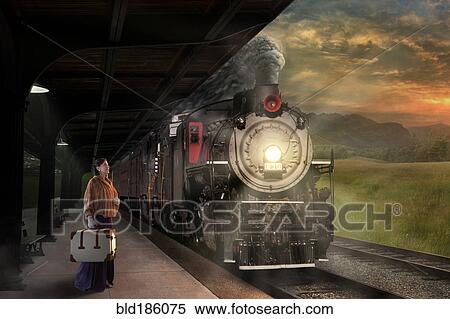 Stock Photography - Caucasian woman waiting on train platform. Fotosearch