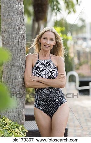 Stock Photo - Caucasian woman wearing swimsuit outdoors. Fotosearch