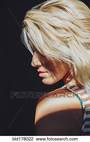 Stock Image - Caucasian woman with blonde hair. Fotosearch